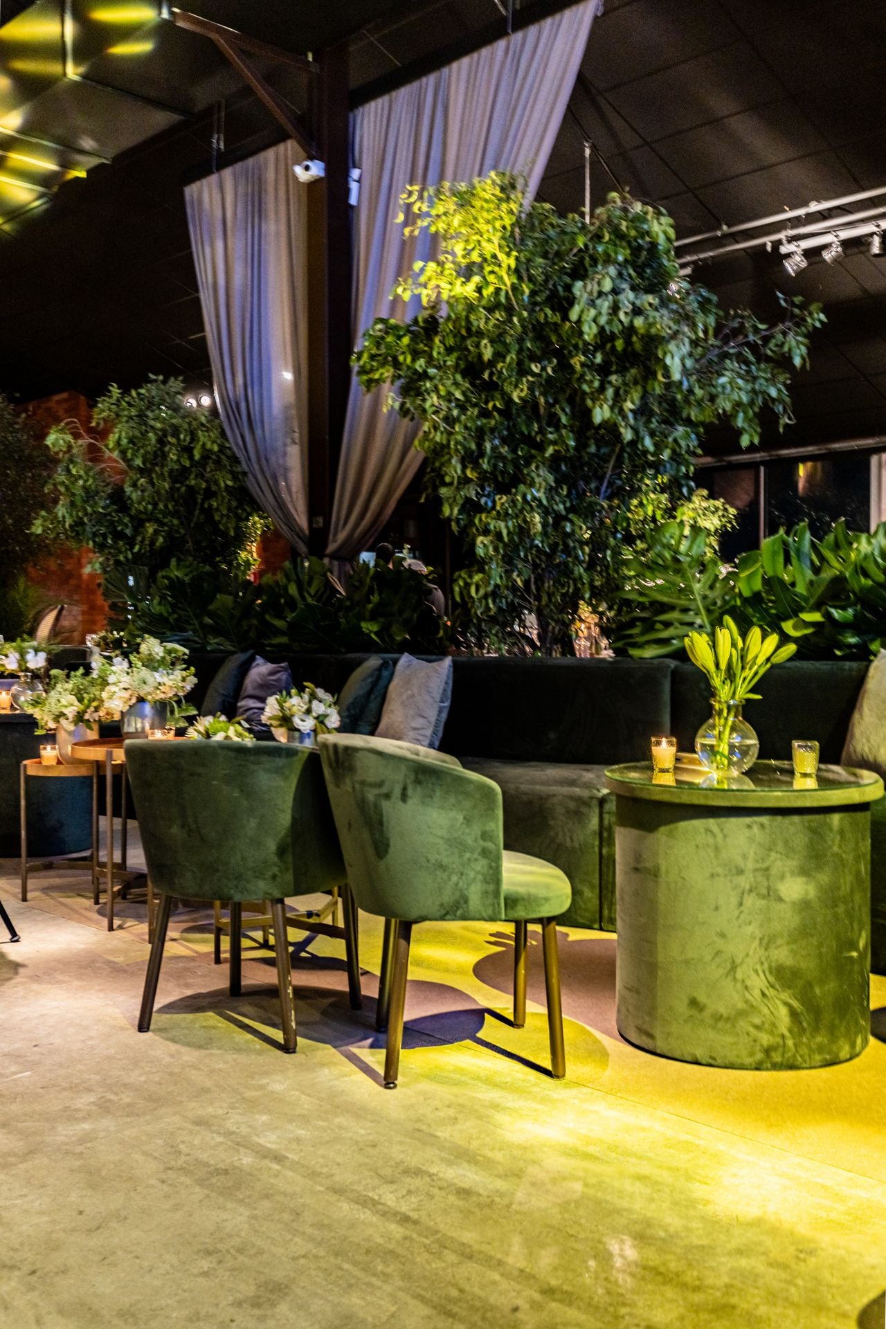 Dark green restaurant chairs and tables — commercial seating interiors inspiration